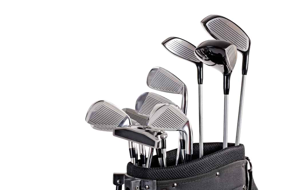 set of metal golf clubs in bag