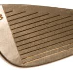 Close up detailed view of a golf club three iron