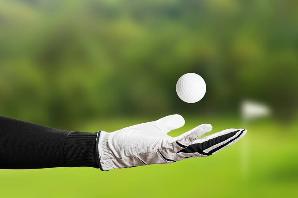 Golfer Wearing Golf Glove throw ball