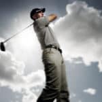 Golfer shooting a golf ball