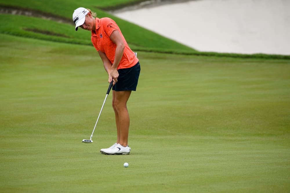 Stacy Lewis putts on the green