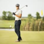 Young man playing golf