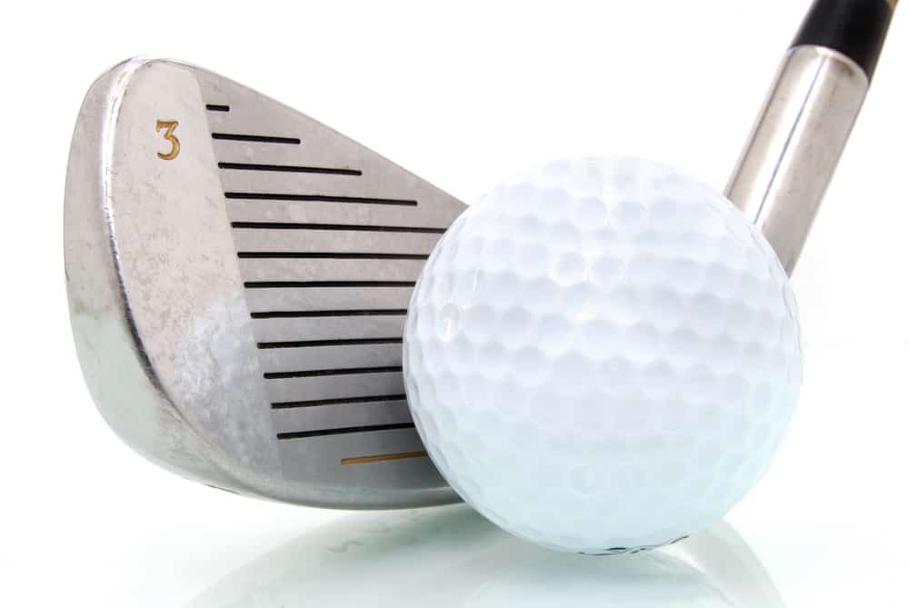 golf ball and club