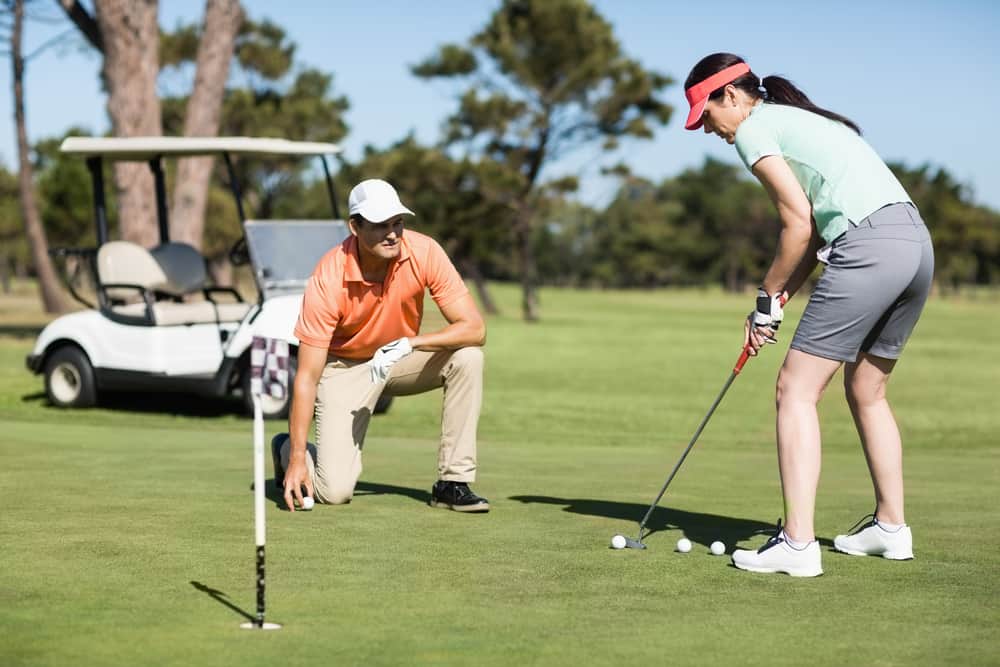 Couple playing golf