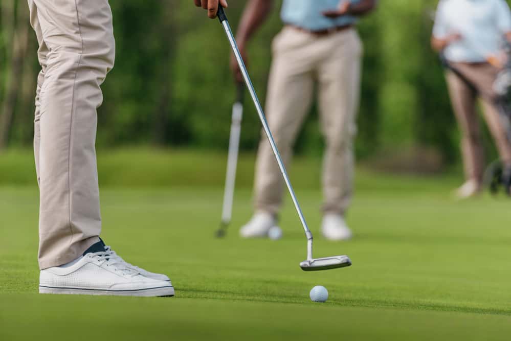 Golfer getting ready to shot on fairway