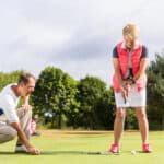 Senior woman and golf pro
