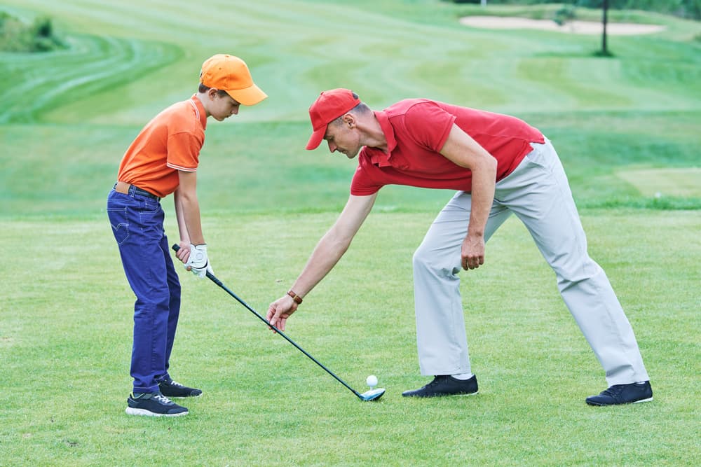 Boy playing golf in summer