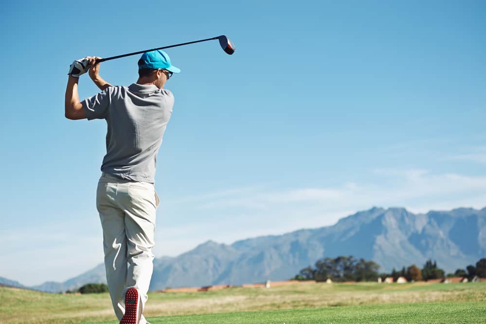 Golfer hitting tee shot