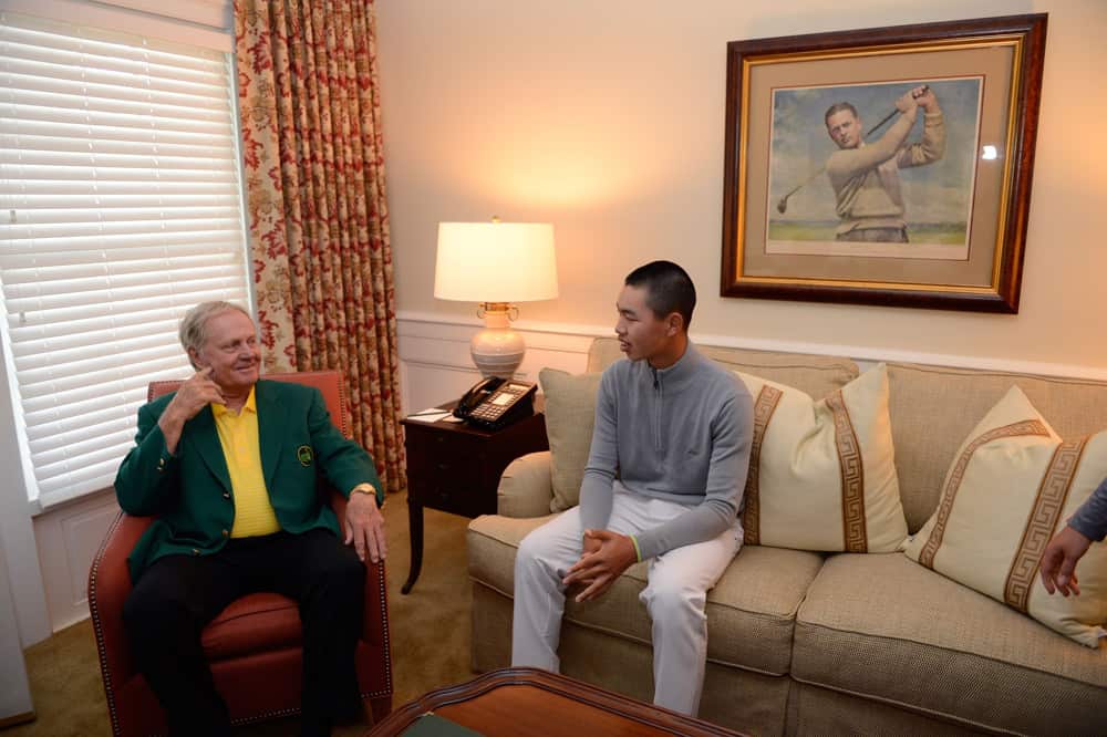 April 10, 2013 Masters champion Jack Nicklaus (L) talks with Guan Tianlang of China during Practice Round 3 for the 2013 Masters, at the Augusta National Golf Club in Augusta, Georgia, the United States, on April 10, 2013