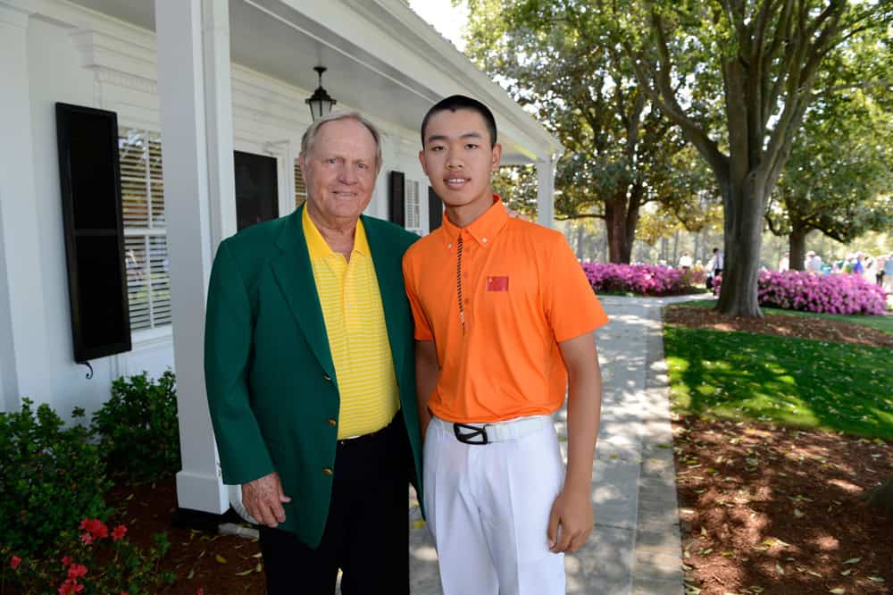 Masters champion Jack Nicklaus (L) poses for photos with Guan Tianlang of China during Practice Round 3 for the 2013 Masters, at the Augusta National Golf Club in Augusta, Georgia, the United States, on April 10, 2013