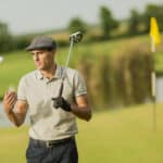 Young man playing golf