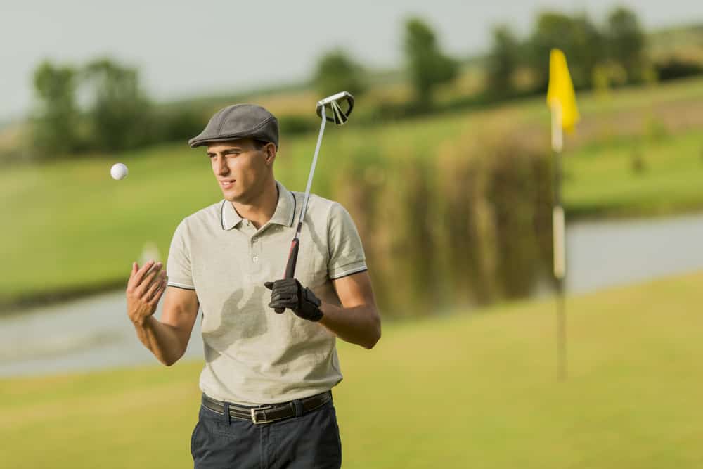 Young man playing golf