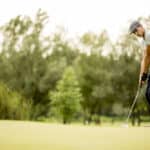 Young man playing golf