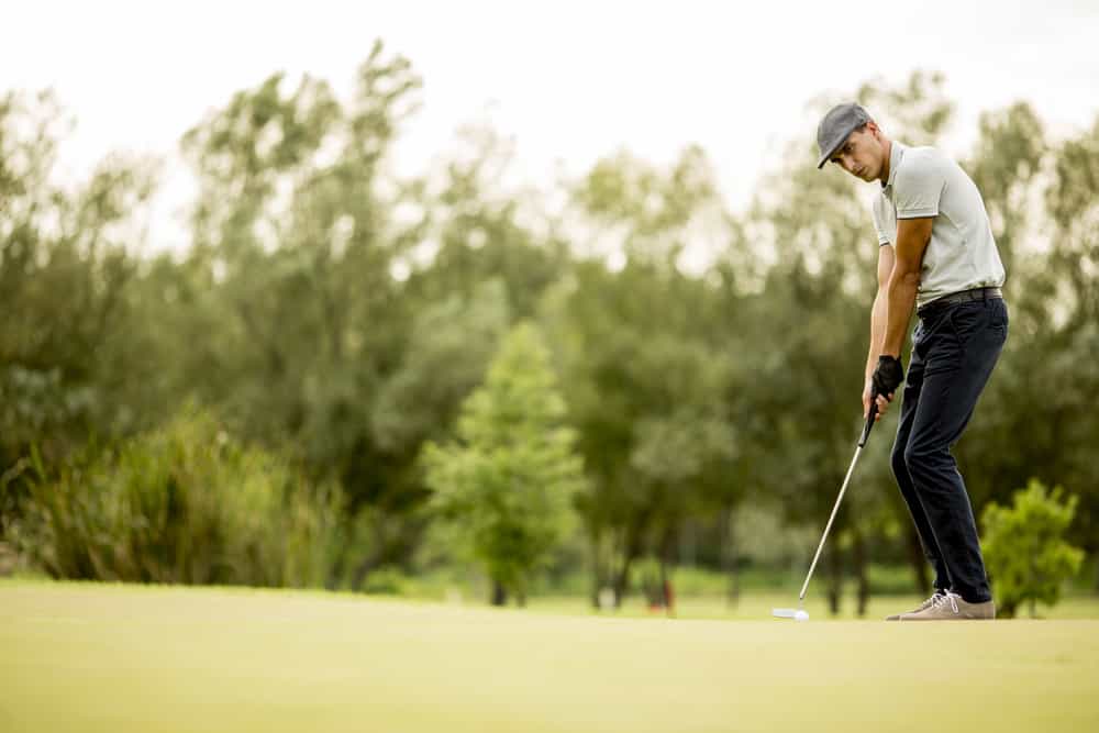 Young man playing golf