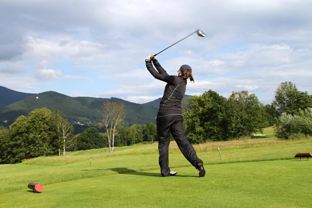 Girl playing golf