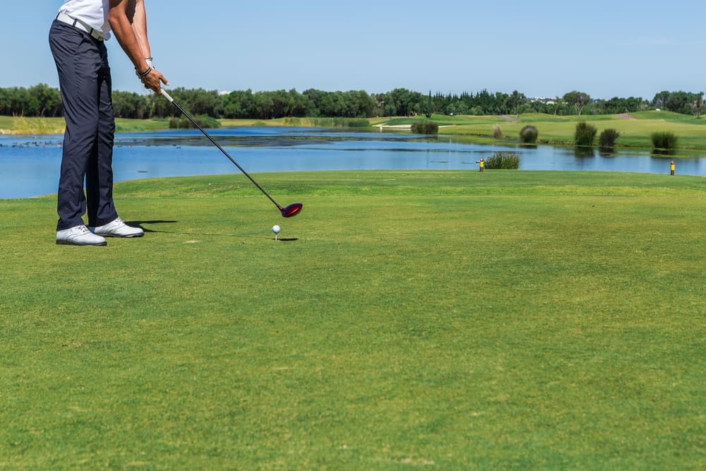 Male golfer narrow stance