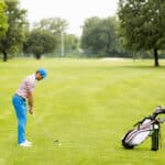Young man playing golf