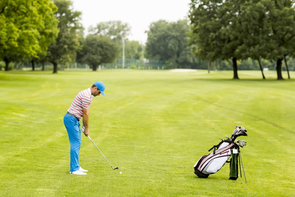 Young man playing golf