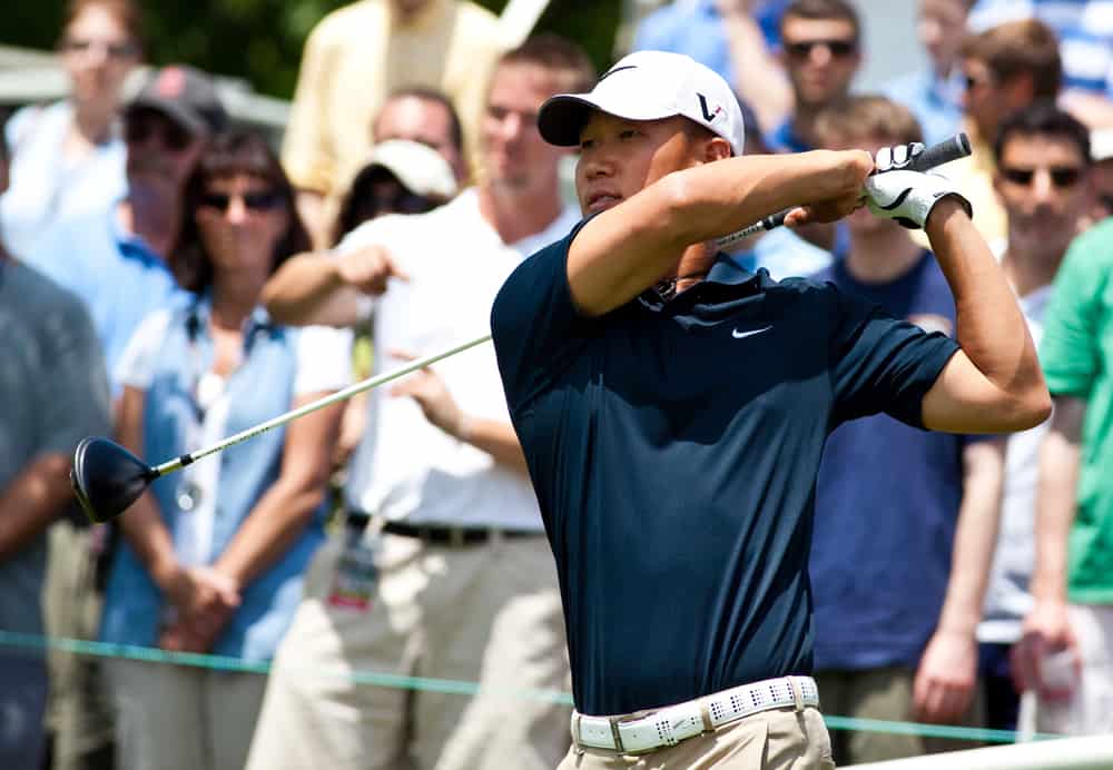 Golfer Anthony Kim tees off on the first tee