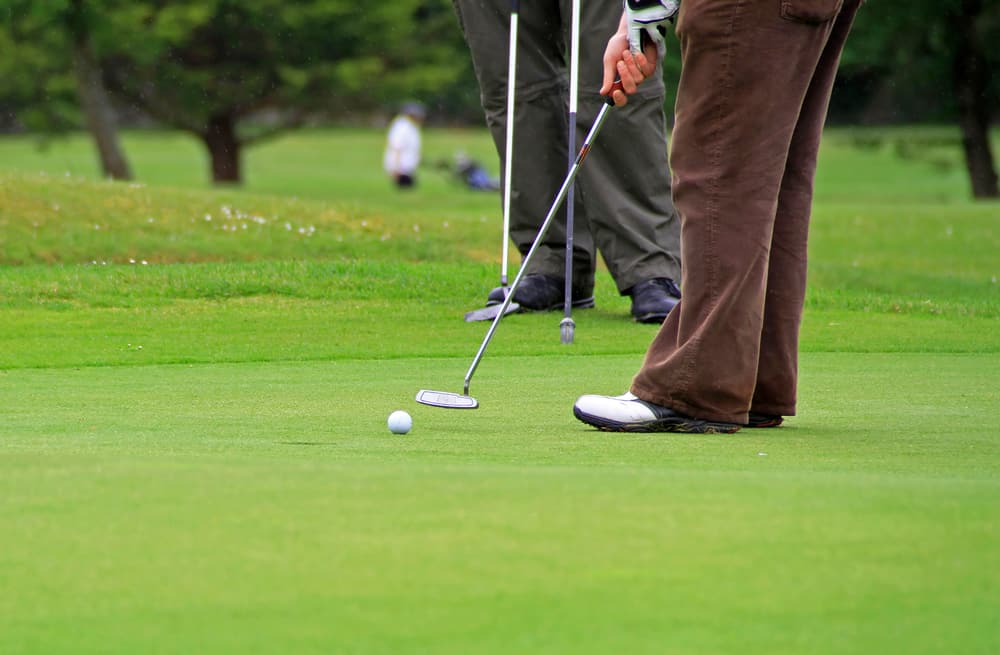 Putting golf ball on the course