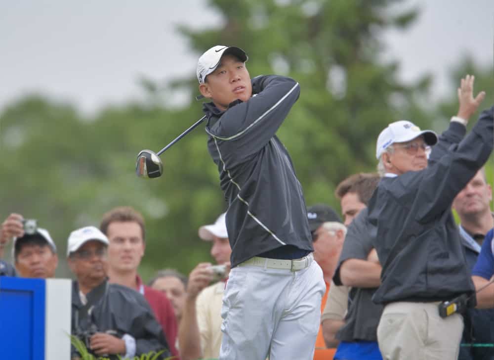 golfer Anthony Kim watches his drive