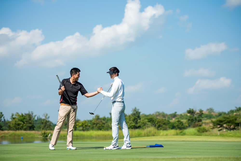 man with friend playing game shot